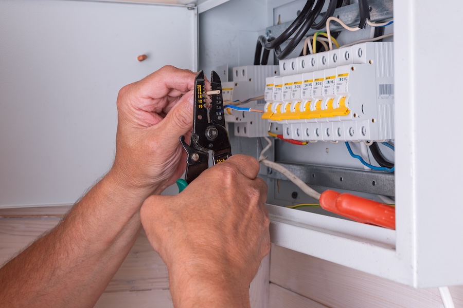 electrician working on electrical box with wire st 2026 01 09 11 56 21 utc